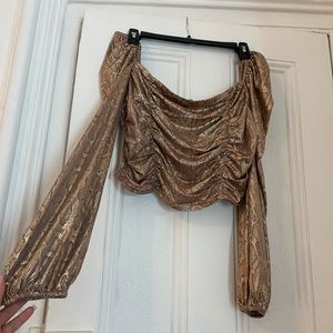 Shiny gold snake skin print matching set, top and skirt.